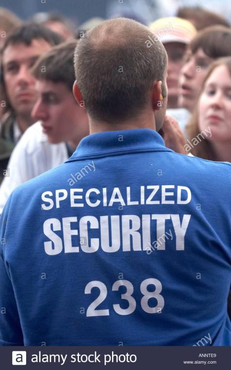 specialised-security-staff-man-in-front-of-pyramid-stage-at-glastonbury-ANNTE9.jpg