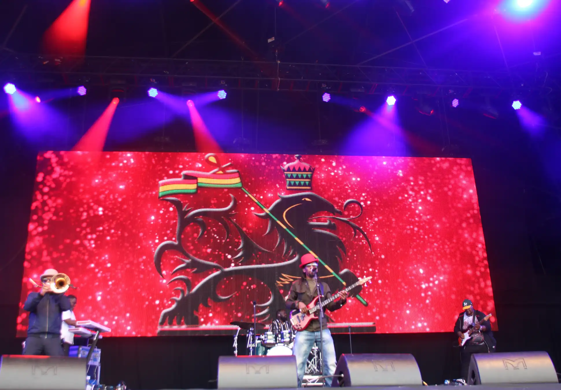 Full-band photo of Aswad performing on stage at Rewind Festival North 2024