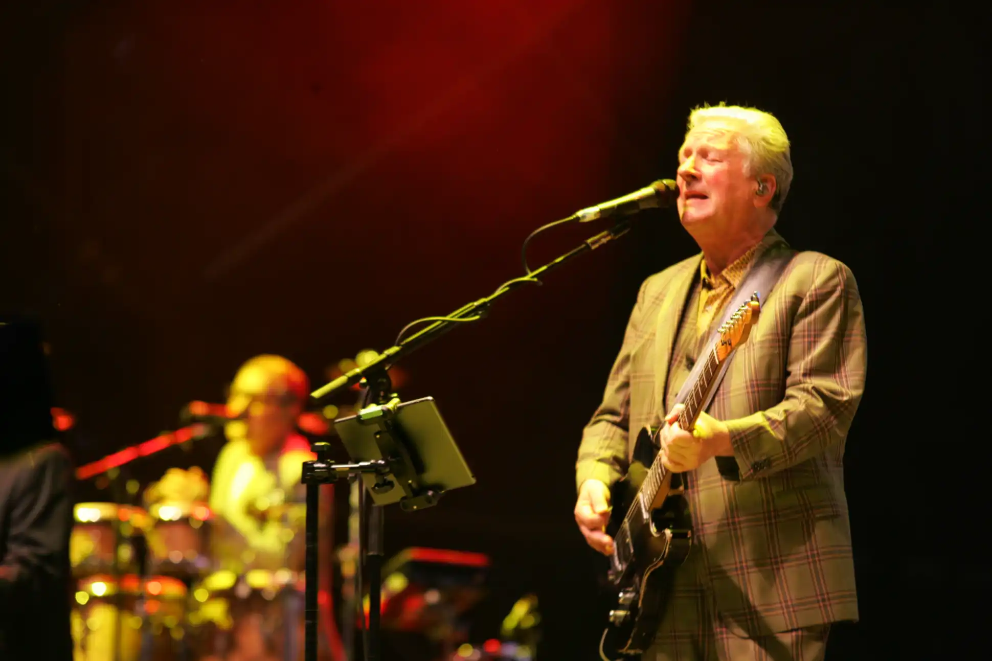 Glenn Tilbrook of Squeeze sings on stage at Rewind Festival North 2024