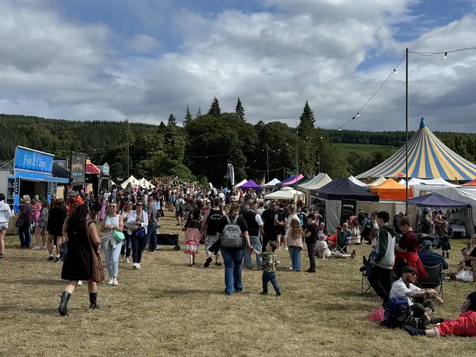 Crowds walking through Belladrum's non-musical attractions such as stalls and the kids' area 