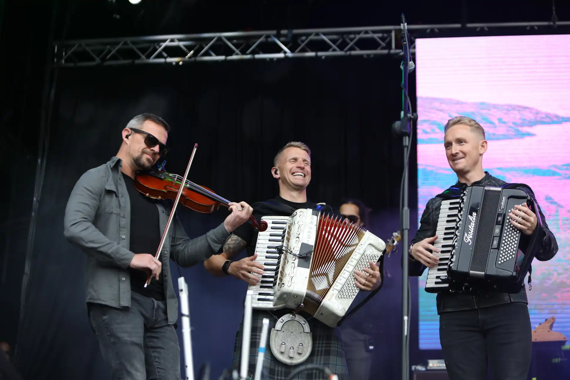 Heartland Festival In Pitlochry 2024 - Skerryvore with accordion, fiddle, and bagpipes on stage