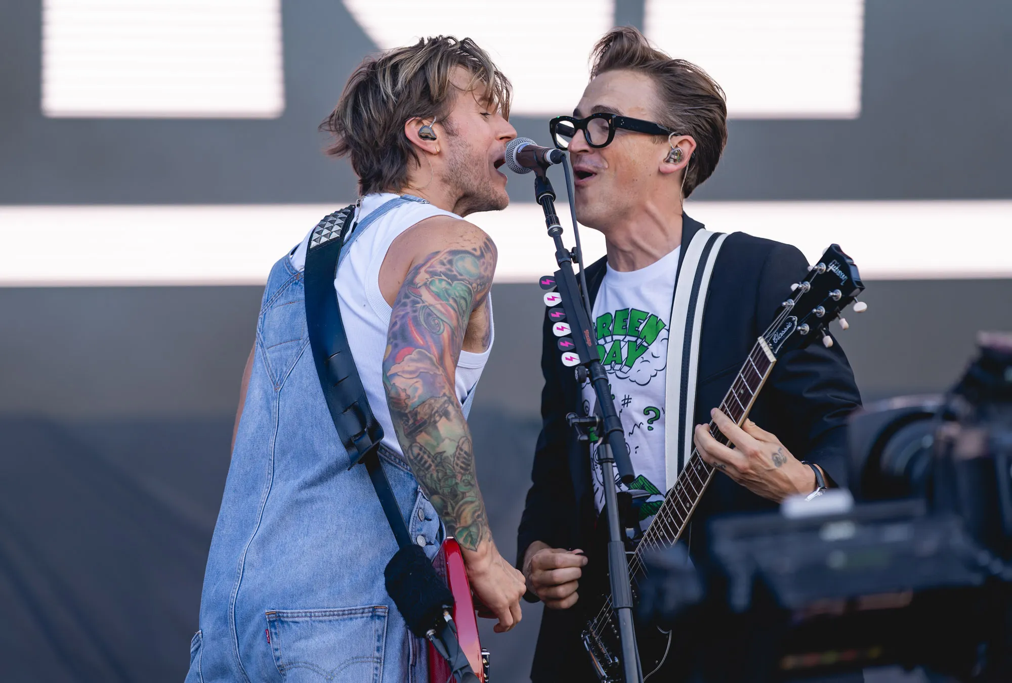 Mcfly perform at the Isle of Wight Festival 2024 with Tom Fletcher wearing a Green Day t-shirt