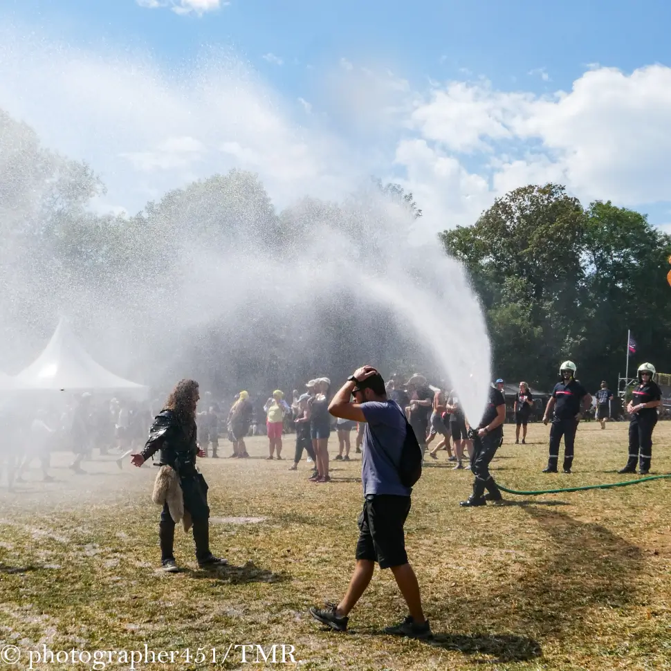 Firemen dowsing the crowd at Rock The Lakes Festival 2023